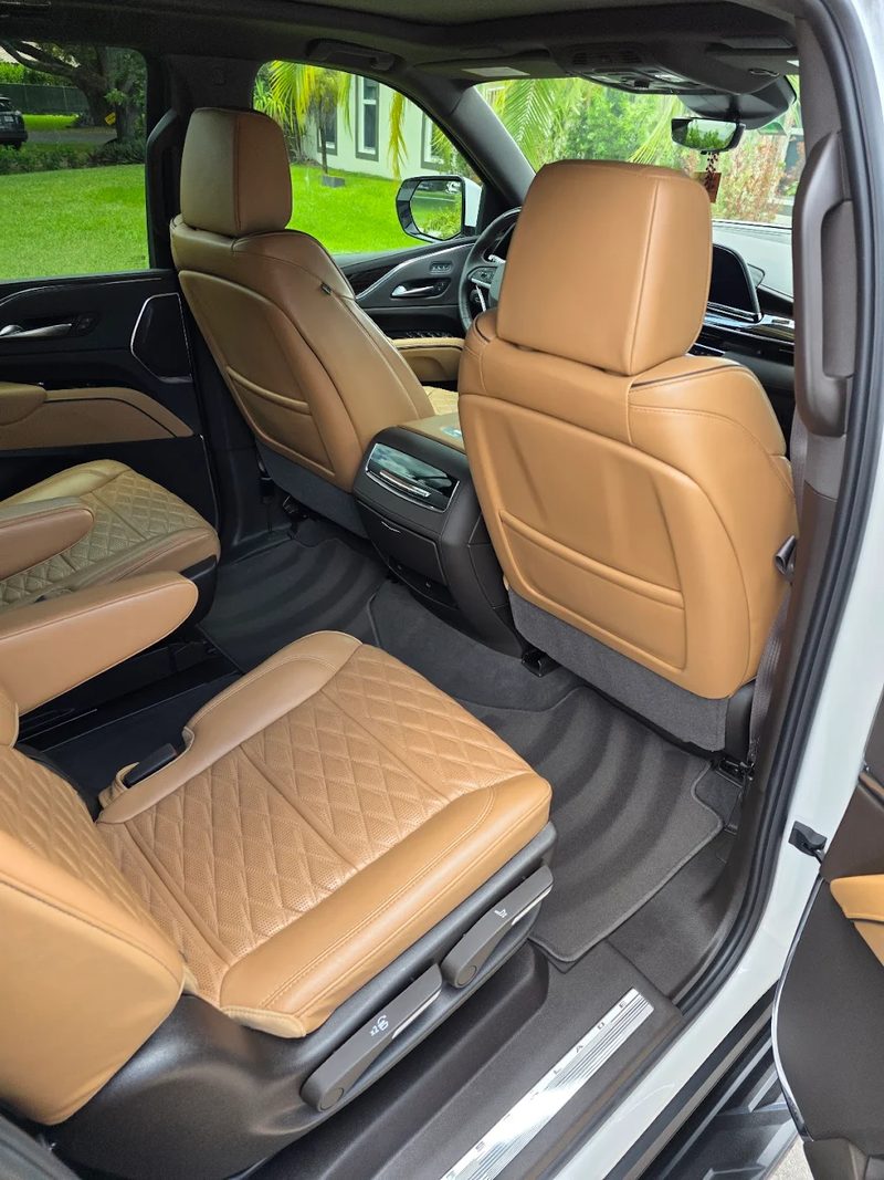Cognac quilted leather rear seats and vacuumed carpet in an SUV after a full interior detail